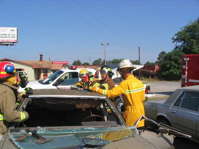 Firefighters Around a Vehicle