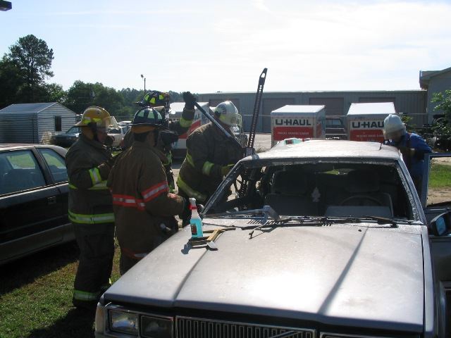 Firefighters Opening a Car Window