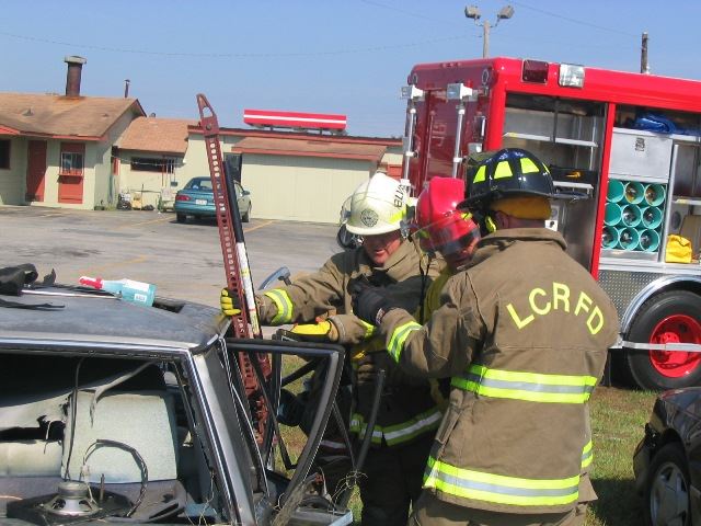 Firefighters Accessing a Car
